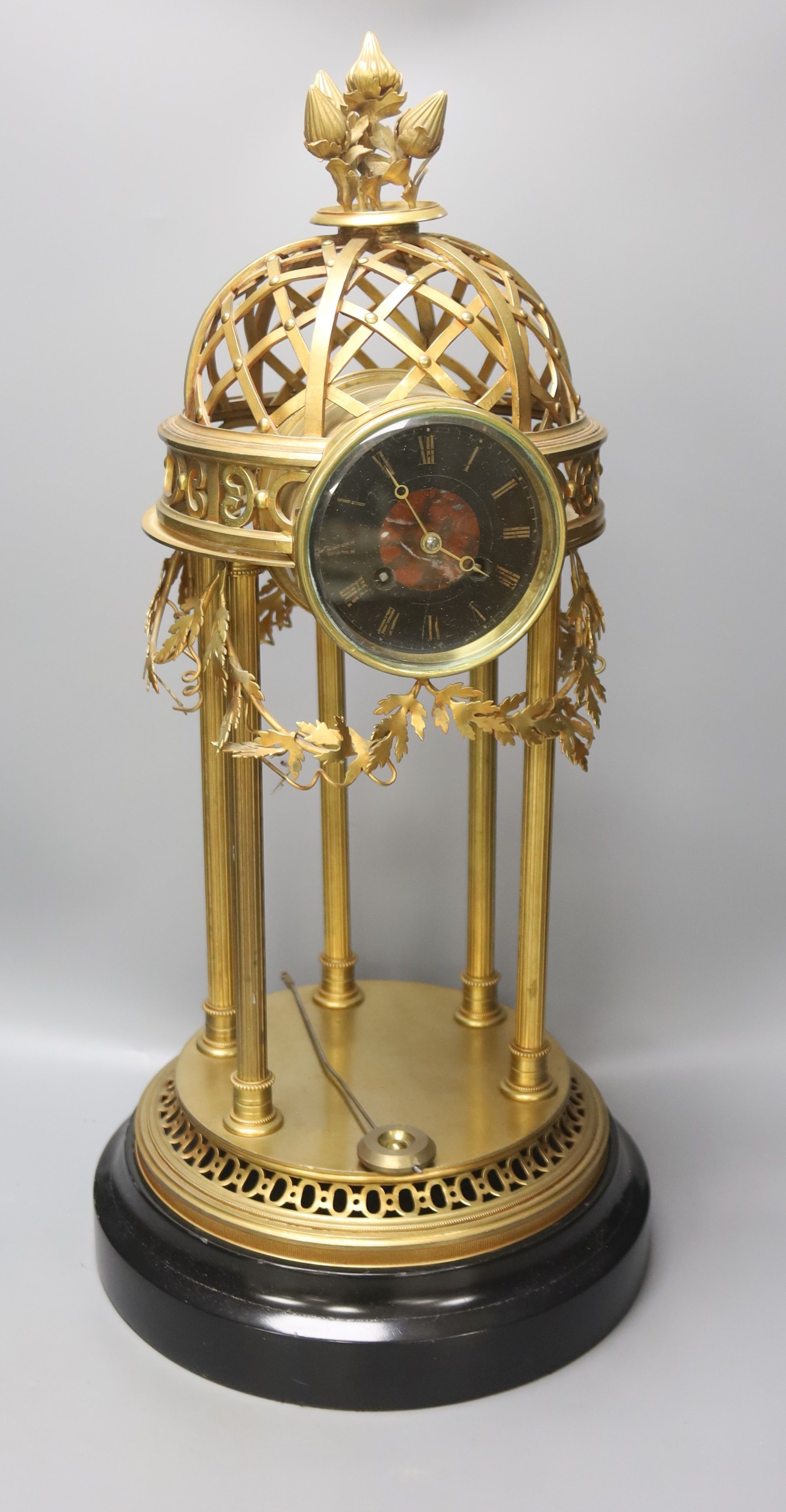 A large gilt metal Portico mantel clock, with slate and rouge marble dial, height 61cm